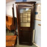 A Georgian mahogany corner cabinet