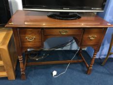 An oak priory style desk, 101cm wide, 49cm deep, 76cm high