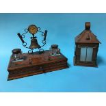 A copper lantern and an oak desk tidy