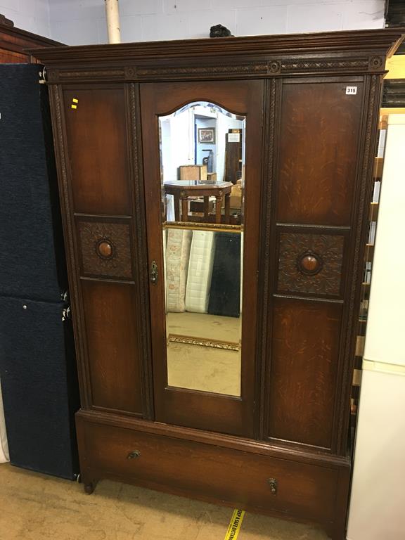 An oak mirror door wardrobe