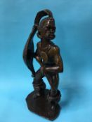 A carved tribal soapstone figure of a warrior, 57c