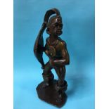 A carved tribal soapstone figure of a warrior, 57c