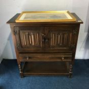 An oak linenfold cupboard