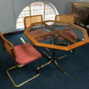 An octagonal kitchen table and three chairs