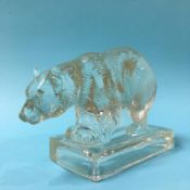 A 1930s Art Deco clear tinted Opalique pressed glass model of a Polar Bear by Etienne Frankenhauser,