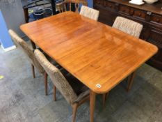 A walnut extending dining table and four chairs