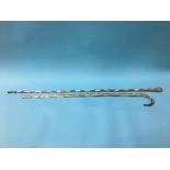 Two clear glass spiral twist canes