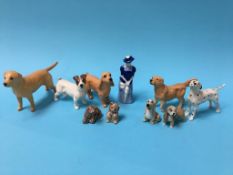 Five small Beswick dogs and a quantity of Wade