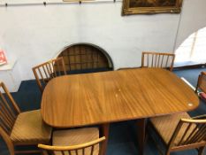 A walnut gateleg table and five chairs