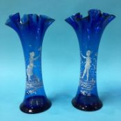 A pair of blue glass Mary Gregory style spill vase