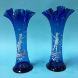 A pair of blue glass Mary Gregory style spill vase