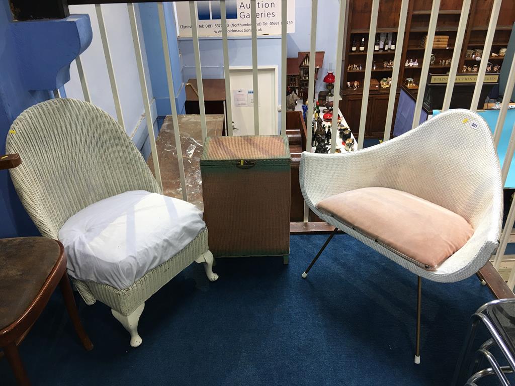 Two Lloyd Loom chairs and a linen basket