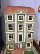 A large Georgian style dolls house (no contents), 62cm wide, 102cm high