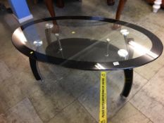 A glass top occasional table