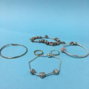 Three charm bracelets, two 9ct gold rings, 3.8g etc.