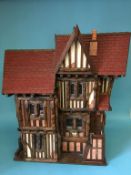 A dolls house (no contents), 82cm wide, 81cm height