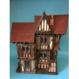 A dolls house (no contents), 82cm wide, 81cm height