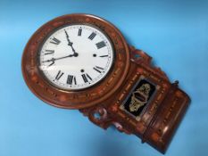 A walnut cased dial clock, with eight day movement and marquetry inlay