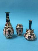Three Royal Crown Derby vases, printed marks, 1128, 16cm, 11cm and 8cm high (3)