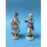 A pair of Derby figures of a lady holding a basket of flowers, with flowers in her hair and a