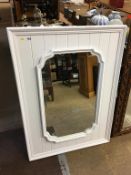 A white framed mirror