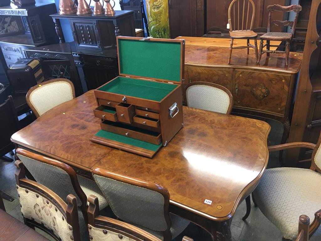 A walnut eight piece dining room suite, comprising six chairs (4+2), extending table and sideboard