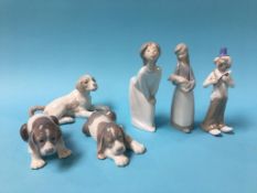 Two Lladro figures, two Lladro dogs, a Nao dog and one other figure (6)