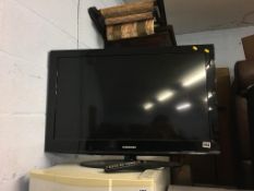 A Samsung 31" TV, with remote