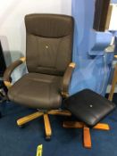 A brown office swivel armchair and black footstool