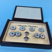 A leather cased silver collar stud and cuff link set