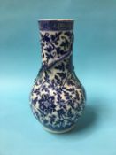 A Chinese blue and white vase, with waisted neck and baluster body, decorated with dragons, 35cm