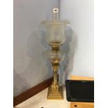 A brass Corinthian column oil lamp, with etched glass shade and reservoir