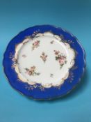 A 19th century porcelain plate, decorated with bouquets of flowers, 26cm diameter