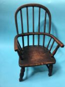 A child's stick back Windsor chair