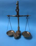 A set of brass balance scales and weights