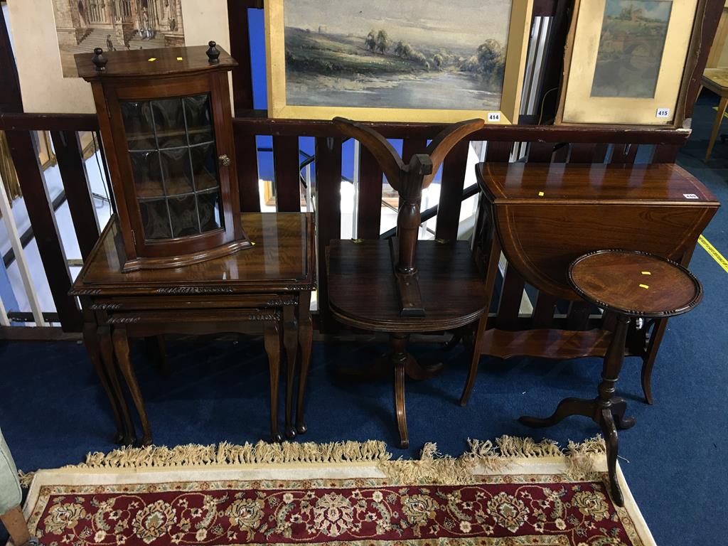 An Edwardian mahogany Sutherland table, nest of tables, small mahogany wall cabinet with leaded