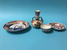 A Derby Imari pattern plate, painted marks, 21cm diameter, a porcelain tea bowl and saucer and a