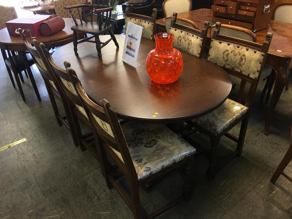 An oak Old Charm extending dining table and six chairs