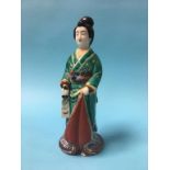 An Oriental porcelain figure of a lady, 28cm high