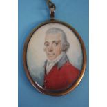 A Georgian portrait miniature of a gentleman, on ivory with braided lock of hair verso