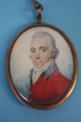 A Georgian portrait miniature of a gentleman, on ivory with braided lock of hair verso