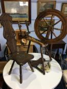 An Ashford spinning wheel and a carved chair