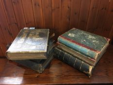 A quantity of leather bound bibles and journals etc.