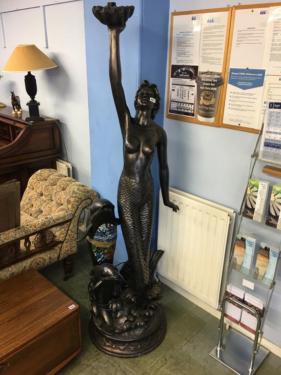 A standard lamp in the form of a mermaid and dolphins