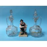 A pair of decanters and a Staffordshire figure of a cobbler