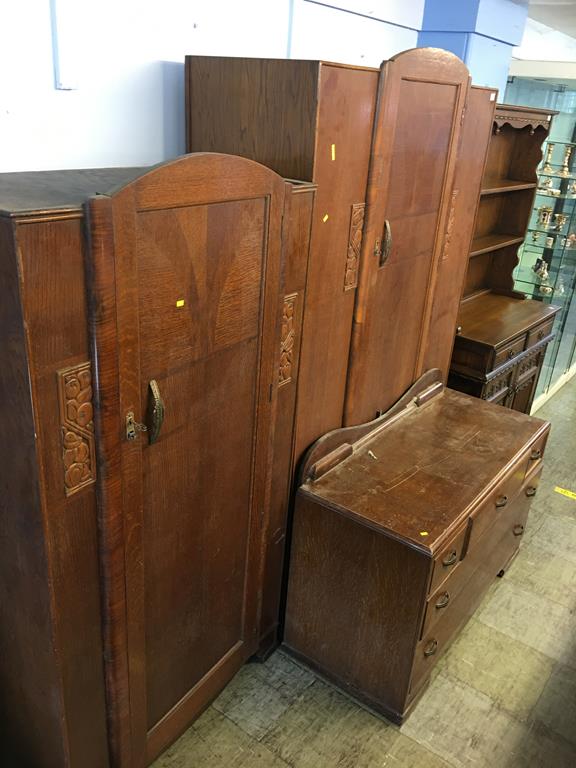 An oak three piece bedroom suite