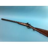 An antique double barrel shotgun by Tipping and Lawden