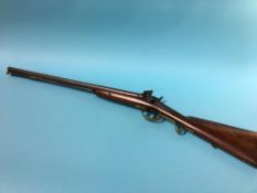 An antique double barrel shotgun by Tipping and Lawden