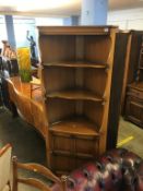 An Ercol corner cabinet