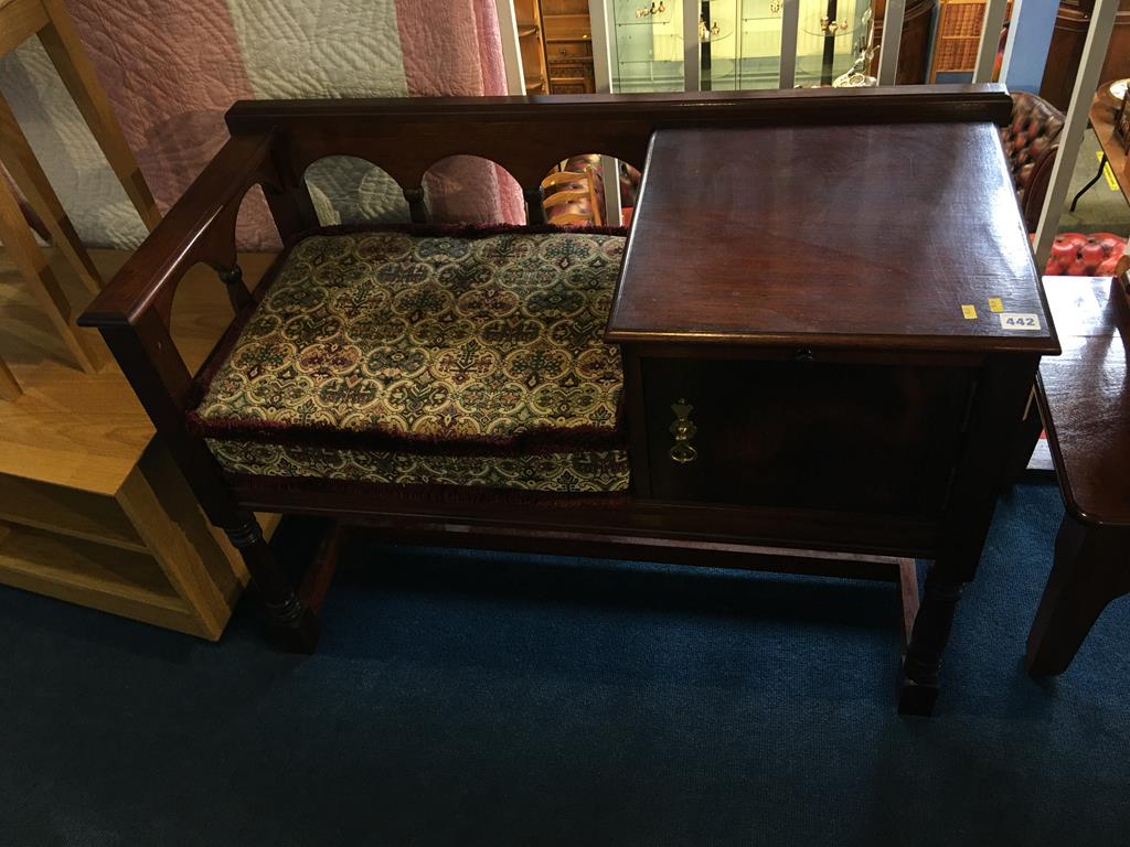 An oak telephone seat